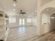 Open living room with recessed lighting, neutral walls, and bright natural light from the French doors at 30517 N Maple Chase Dr, San Tan Valley, AZ 85143