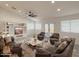 Spacious living room features a cozy seating arrangement and built-in shelving with a TV at 30517 N Maple Chase Dr, San Tan Valley, AZ 85143