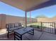 Covered patio with cozy seating area perfect for outdoor relaxation at 30517 N Maple Chase Dr, San Tan Valley, AZ 85143