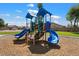 Fun playground in the community park with colorful play structures and swings at 30517 N Maple Chase Dr, San Tan Valley, AZ 85143