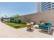 Rooftop lounge space with cornhole and comfortable seating, set against a modern building at 3131 N Central Ave # 7004, Phoenix, AZ 85012