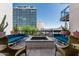 Spacious balcony with a fire pit and comfortable seating, perfect for outdoor entertaining and relaxation at 3131 N Central Ave # 7004, Phoenix, AZ 85012