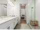 Elegant bathroom featuring double vanity, sleek countertops, and a glass-enclosed shower, creating a luxurious and functional space at 3131 N Central Ave # 7004, Phoenix, AZ 85012