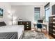 Bright bedroom with hardwood floors, a large window, and neutral décor, creating a peaceful and inviting atmosphere at 3131 N Central Ave # 7004, Phoenix, AZ 85012