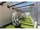 Tranquil hammock garden with egg chair swings on an astroturf lawn, surrounded by modern buildings at 3131 N Central Ave # 7004, Phoenix, AZ 85012