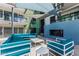 Stylish outdoor lounge area with comfortable seating, a blue fireplace, and sunshade at 3131 N Central Ave # 7004, Phoenix, AZ 85012