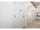 The image displays a row of numbered, white storage units inside the building at 3131 N Central Ave # 7004, Phoenix, AZ 85012