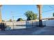 Backyard pool area featuring a black metal safety fence at 3421 W Montecito Ave, Phoenix, AZ 85017