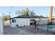 Backyard exterior view, featuring a black metal safety fence around a swimming pool at 3421 W Montecito Ave, Phoenix, AZ 85017