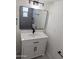 Bathroom with modern vanity, sleek mirror, and stylish fixtures at 3421 W Montecito Ave, Phoenix, AZ 85017