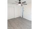 Bedroom with closet and neutral gray wood-look floors at 3421 W Montecito Ave, Phoenix, AZ 85017