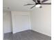 This bright bedroom has a ceiling fan and sliding-door closet at 3421 W Montecito Ave, Phoenix, AZ 85017