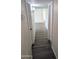 View of a hallway featuring grey wood-look floors and white walls at 3421 W Montecito Ave, Phoenix, AZ 85017
