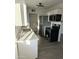 Modern kitchen featuring stainless steel appliances, white cabinets, and sleek countertops at 3421 W Montecito Ave, Phoenix, AZ 85017