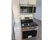 Modern kitchen showcasing stainless steel appliances, including a sleek range and microwave at 3421 W Montecito Ave, Phoenix, AZ 85017