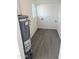 Bright laundry room featuring wood-look floors, window, and all the utility hookups at 3421 W Montecito Ave, Phoenix, AZ 85017