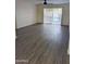Living room featuring sliding glass doors that open up to a backyard swimming pool at 3421 W Montecito Ave, Phoenix, AZ 85017