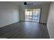 Spacious living room with sliding glass doors leading to the backyard pool area at 3421 W Montecito Ave, Phoenix, AZ 85017