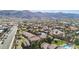 An aerial view showcases this neighborhood's well-maintained landscaping, desert surroundings, and proximity to mountain views at 3511 E Baseline Rd # 1098, Phoenix, AZ 85042