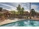A sparkling pool and spa are surrounded by lush landscaping and desert views, with poolside lounges at 3511 E Baseline Rd # 1098, Phoenix, AZ 85042