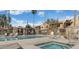 A sparkling pool and spa in community area with desert landscaping and stone structure for relaxation at 3511 E Baseline Rd # 1098, Phoenix, AZ 85042