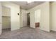 Spacious bedroom with neutral walls, carpet, and attached bathroom and walk-in closet at 3531 E Norwood Cir, Mesa, AZ 85213
