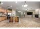Open kitchen with granite countertops, stainless steel appliances, and a large island for entertaining at 3531 E Norwood Cir, Mesa, AZ 85213