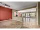 Spacious living area showcasing travertine floors, neutral paint palette, and seamless flow to dining area at 3531 E Norwood Cir, Mesa, AZ 85213