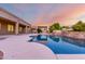 Resort style pool with a Baja step and lush landscaping at 3531 E Norwood Cir, Mesa, AZ 85213