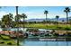 Picturesque view of a pond with a waterfall and lush landscaping in the community at 3566 N 166Th Dr, Goodyear, AZ 85395
