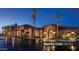 Exterior view of the sports club facility at dusk with palm trees at 3566 N 166Th Dr, Goodyear, AZ 85395