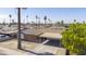 Aerial view showcasing a charming home with a covered carport and mature palm trees at 3823 W Rose Ln, Phoenix, AZ 85019