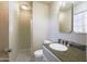 Updated bathroom featuring a modern vanity, elegant sink, and shower with classic tiles at 3823 W Rose Ln, Phoenix, AZ 85019