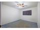 Bedroom featuring a window with dark curtains at 3823 W Rose Ln, Phoenix, AZ 85019