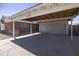 Spacious carport offering covered parking, adjacent garage, and classic brick home exterior at 3823 W Rose Ln, Phoenix, AZ 85019