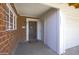 Charming front entrance featuring a classic wooden door, brick accents, and convenient garage access at 3823 W Rose Ln, Phoenix, AZ 85019