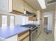 Well-lit kitchen with new appliances, ample cabinet space, and a convenient layout, perfect for cooking at 3823 W Rose Ln, Phoenix, AZ 85019
