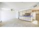 Bright, open-concept living space featuring neutral walls, tile floors, and a seamless transition to the kitchen at 3823 W Rose Ln, Phoenix, AZ 85019