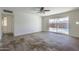 Living room with sliding glass doors leading to the backyard and pool at 3823 W Rose Ln, Phoenix, AZ 85019
