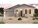 Inviting single-story home featuring a two car garage and desert landscaping with accent lighting at 39980 W Sparks Ln, Maricopa, AZ 85138
