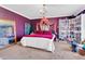 Cozy bedroom featuring a decorative chandelier, ample shelving, and a comfortable bed at 40638 N High Meadows Dr, San Tan Valley, AZ 85140