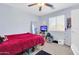 Bedroom with a window, carpet floors, and a television at 40638 N High Meadows Dr, San Tan Valley, AZ 85140