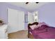 Cozy bedroom with ample closet space and a calming purple color scheme at 40638 N High Meadows Dr, San Tan Valley, AZ 85140