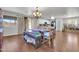 Open dining area with a large table and chairs, featuring an adjacent open kitchen at 40638 N High Meadows Dr, San Tan Valley, AZ 85140