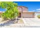 Charming two-story home with a two-car garage and mature landscaping, creating inviting curb appeal at 40638 N High Meadows Dr, San Tan Valley, AZ 85140