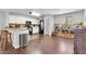 Bright kitchen featuring white cabinets, stainless steel appliances, and hardwood floors at 40638 N High Meadows Dr, San Tan Valley, AZ 85140