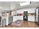 Kitchen featuring stainless steel appliances, white cabinets, and modern backsplash at 40638 N High Meadows Dr, San Tan Valley, AZ 85140