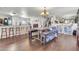 Spacious living room with hardwood floors, breakfast bar, and an abundance of natural light at 40638 N High Meadows Dr, San Tan Valley, AZ 85140