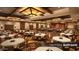 Elegant ballroom featuring tables with white linens, wooden floor and decorative lighting at 4227 W Adobe Dr, Eloy, AZ 85131