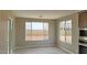 Bright dining area offering natural light, tile floors, neutral paint, and access to kitchen area through large opening at 4227 W Adobe Dr, Eloy, AZ 85131